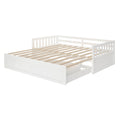 White wooden daybed frame with slatted mattress support, guard rails and built-in under-bed drawers for storage