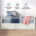 White wooden daybed with built-in underbed storage drawers, blue and pink bedding, space-saving trundle design with non-toxic finishes and classic decor-friendly style
