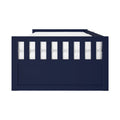 Front view of navy blue wooden toddler bed frame with white mattress and vertical slatted guardrail, modern nursery furniture