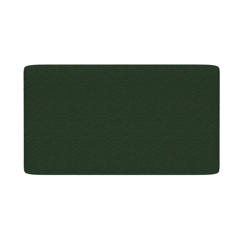 Dark green textured upholstered headboard with rounded corners on white background