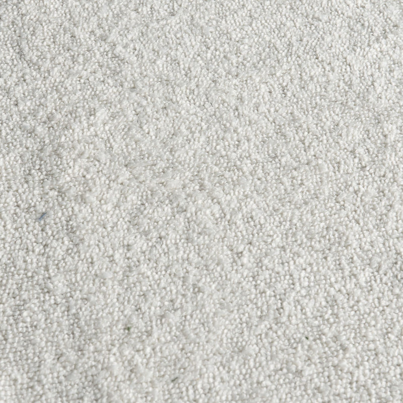Close-up of white plush loop-pile carpet texture — soft, dense fiber rug surface ideal for modern home interiors and flooring