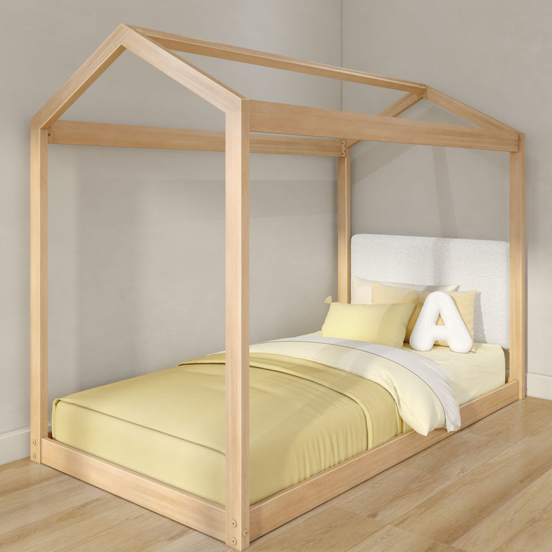 Natural wood house-frame kids bed with canopy roof and yellow bedding, modern Scandinavian toddler bed with plush letter pillow