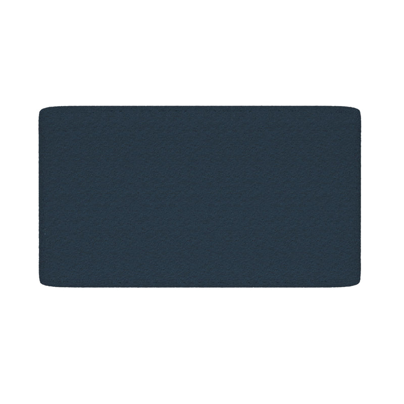 Close-up of navy blue rectangular textured floor mat with rounded corners on white background
