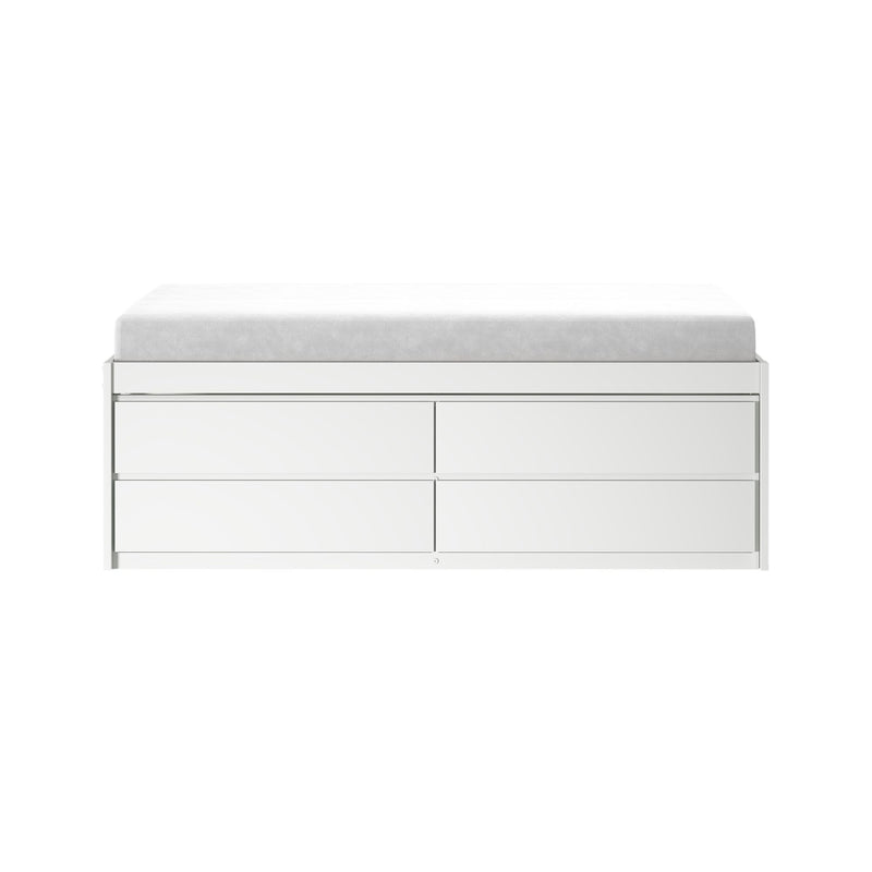 White baby changing pad on modern white dresser with storage drawers, minimalist nursery changing station
