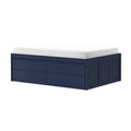 White memory foam mattress on navy blue wooden storage platform bed with built-in drawers, modern space-saving bedroom furniture