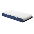 White twin mattress on navy blue trundle bed frame with visible wooden slats – storage bed
