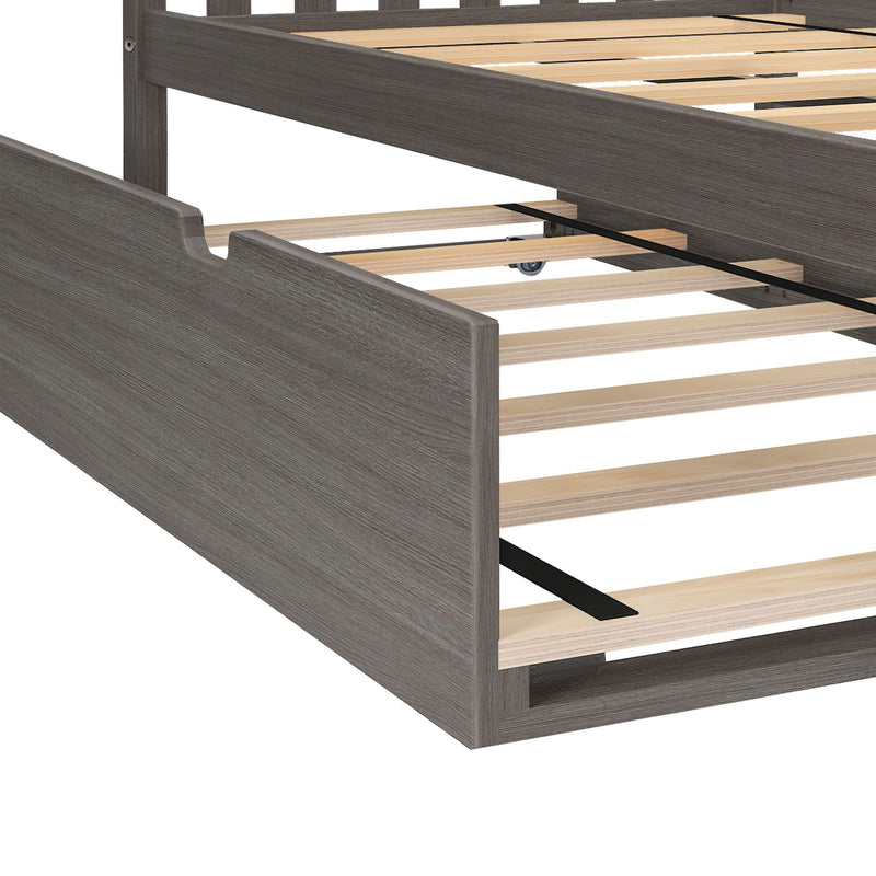 Close-up of gray wood platform bed frame with wooden slats, central metal support strap and underbed trundle wheel — modern rustic bedroom furniture