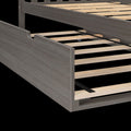 Gray wood platform bed frame with wooden slats, center support rail and hidden trundle wheel, modern storage bedroom furniture