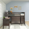 Dark wood kids loft bed with built-in desk and dresser in coastal blue nursery, framed surf van, sun-and-waves and shaka wall art
