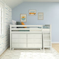 White loft bed with built-in drawers and ladder in coastal kids' bedroom, light blue walls, wave wallpaper and surf-themed framed art