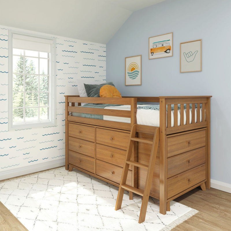 Wooden loft bed with built-in drawers and ladder in coastal-themed kids bedroom with blue accent wall, wave wallpaper and framed art