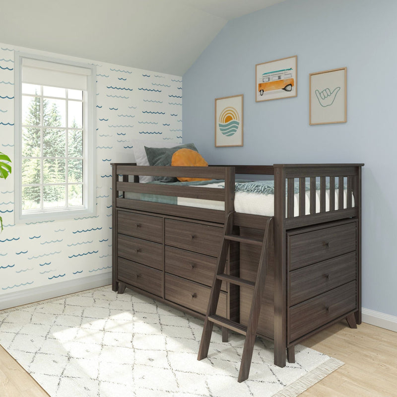 Dark wood kids loft bed with built-in drawers and ladder in coastal-themed bedroom with blue wave wallpaper and surf art
