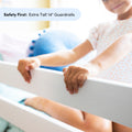 Toddler hands gripping white crib guardrail with extra-tall 14-inch bed rails for nursery safety and fall prevention