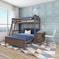 Modern children's bedroom with wooden twin-over-full bunk bed, blue bedding, light-blue paneled accent wall, study desk and geometric rug by large window