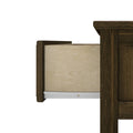 Close-up of a partially open dark walnut dresser drawer showing light maple interior and metal drawer slide, furniture detail.