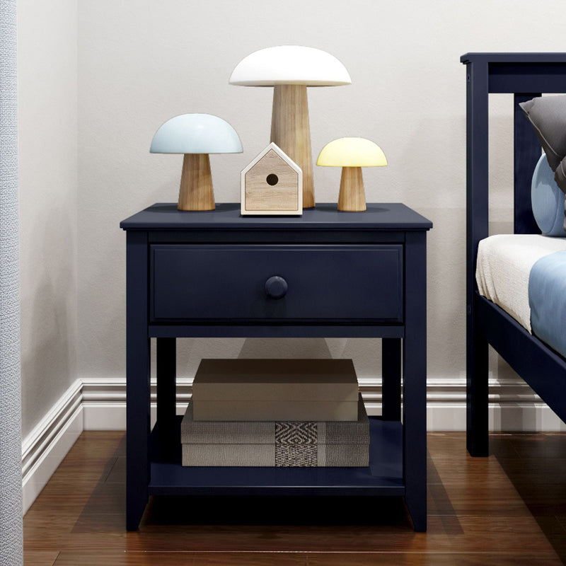 Navy blue nightstand with three wooden mushroom table lamps and small wooden birdhouse on hardwood floor in modern bedroom