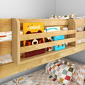 Wooden kids bunk bed with built-in bookshelf holding colorful board books and patterned pillows, modern space-saving kids' bedroom storage