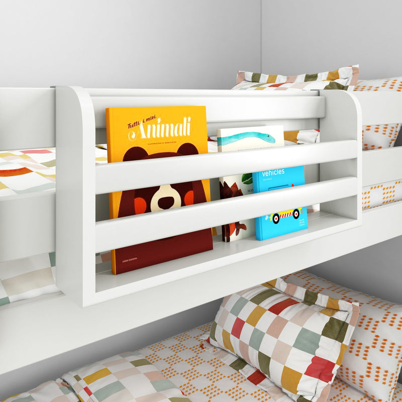 White wooden kids bunk bed with built-in book pocket holding colorful children's books and checkered bedding