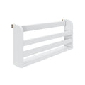 Close-up of a modern white slatted wooden headboard or wall panel with rounded end posts, horizontal slats, and a visible metal wall-mount bracket