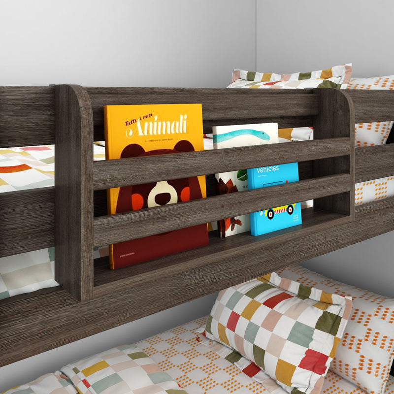 Modern dark-wood kids bunk bed with built-in slatted bookshelf storing colorful children's books, checkered pillows and patterned bedding