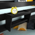 Black bedside storage shelf attached to bunk bed with yellow retro alarm clock and sun-print throw pillows on light blue bedding, modern kids bedroom