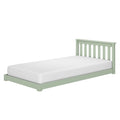 Light green wooden twin bed frame with vertical slatted headboard and white mattress on white background