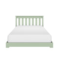 Green wooden twin bed frame with slatted headboard and white mattress on white background