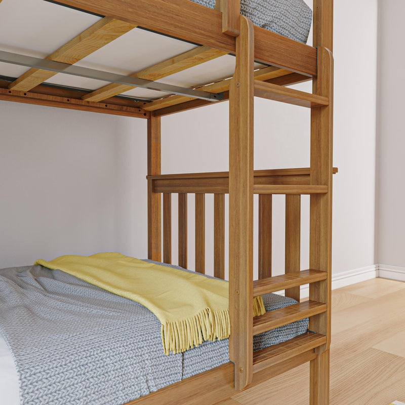 Solid oak bunk bed ladder and slatted guardrail with gray knitted blanket and yellow throw on mattress in a bright bedroom with hardwood floor