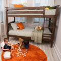 Wooden bunk bed for kids with green gingham bedding and orange pillows, two children playing with wooden blocks on an orange shag rug, stuffed animals on beds — space-saving kids bedroom setup