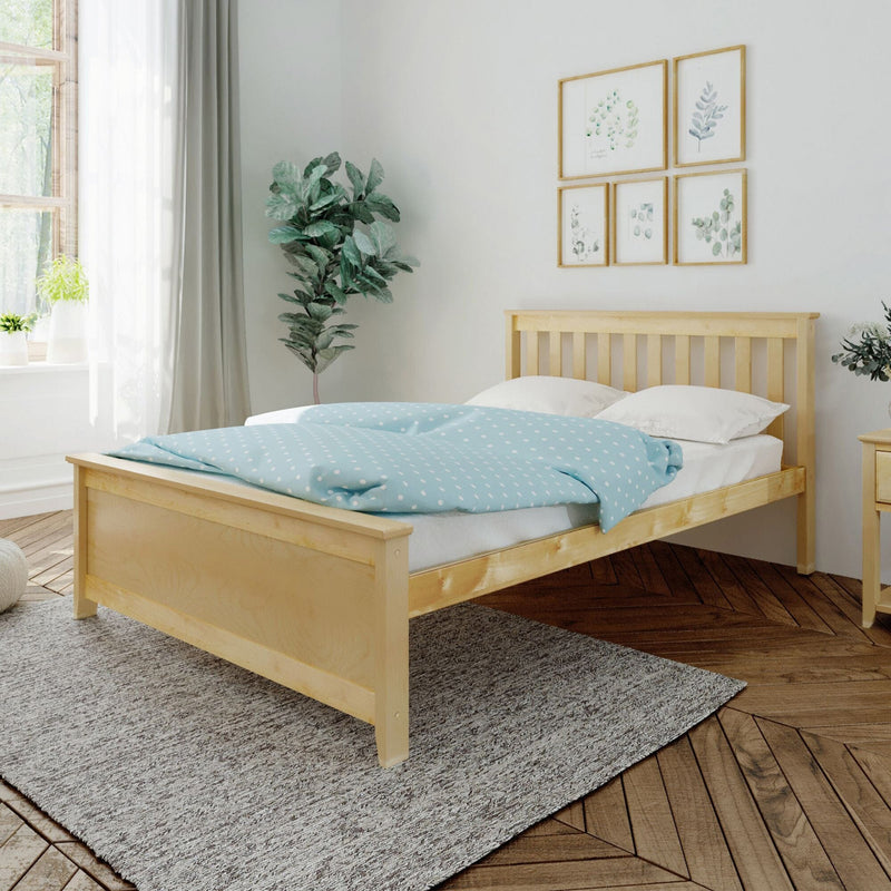 Scandinavian minimalist bedroom with natural wood bed frame, light blue polka-dot duvet, indoor plant, botanical gallery wall and sheer curtains