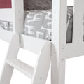 Close-up of white wooden loft bed ladder and frame with gray giraffe-print kids' mattress cover