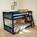 Navy blue wooden bunk bed in children's bedroom with "Good Vibes" pillow, yellow alarm clock, smiley wall art and woven rug