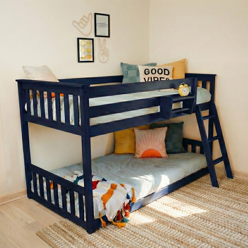 Navy blue wooden bunk bed in children's bedroom with "Good Vibes" pillow, yellow alarm clock, smiley wall art and woven rug