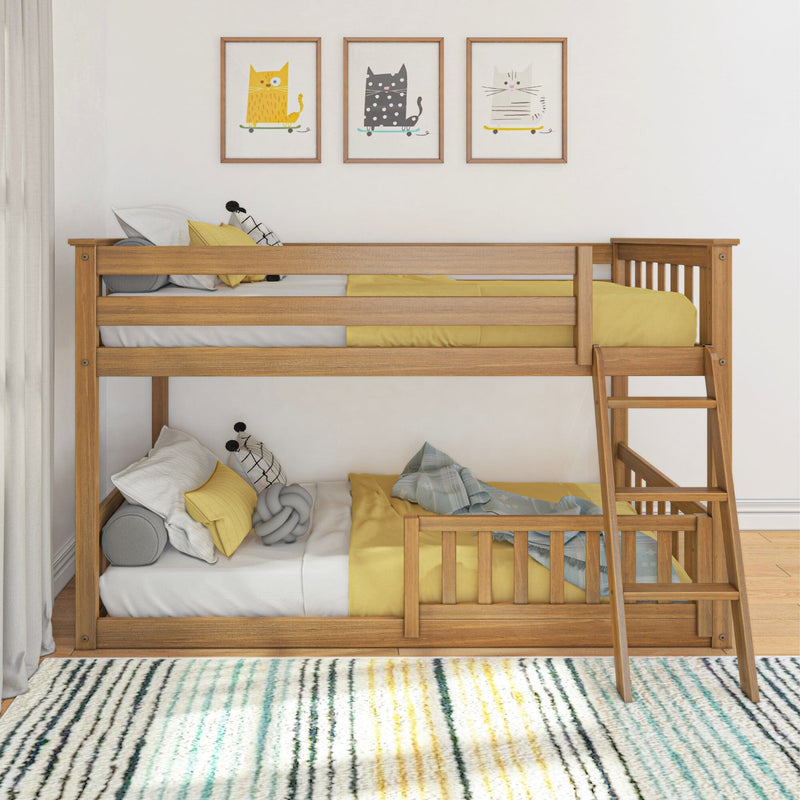 Solid wood twin bunk bed with ladder in children's bedroom, yellow bedding, cute cat wall art and striped area rug, modern kids' room decor