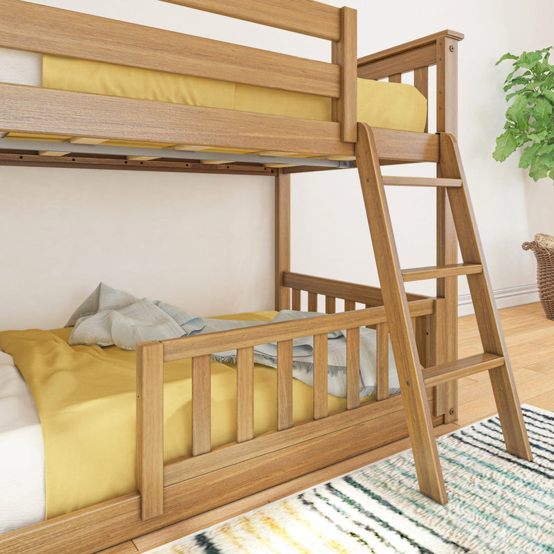 Modern twin-over-twin wooden bunk bed with ladder and yellow bedding in bright kids' bedroom with area rug and plant