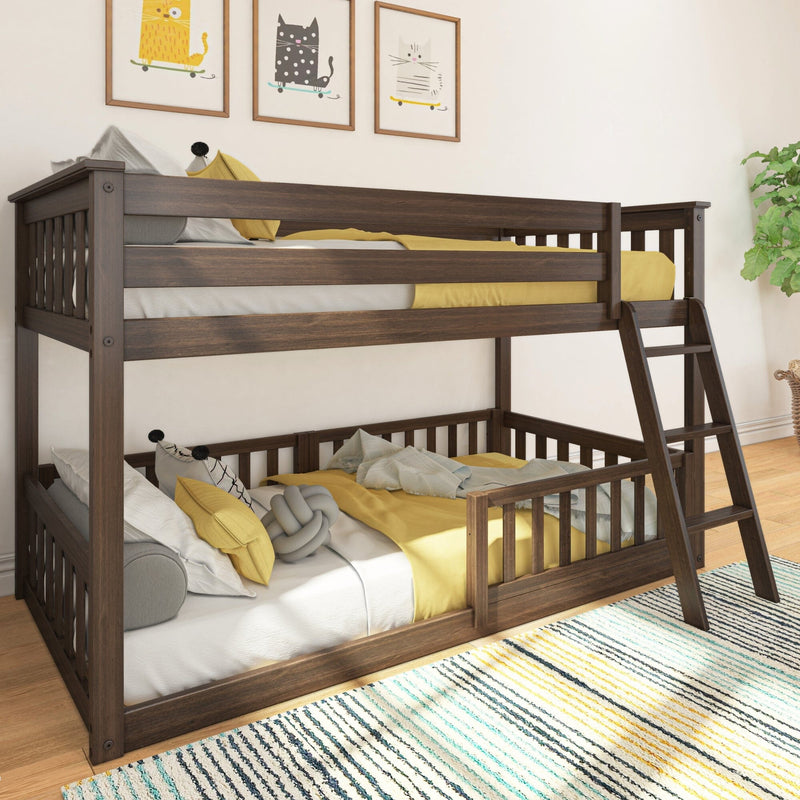 Solid wood twin-over-full bunk bed in dark walnut with ladder and safety rails, yellow bedding and pillows in a modern kids' bedroom with playful wall art
