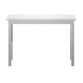 Minimalist white wooden rectangular dining table with straight legs on a white background