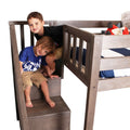 Two boys playing on a gray wooden loft bunk bed with built-in stairs and safety rails, twin mattress and red plush fox
