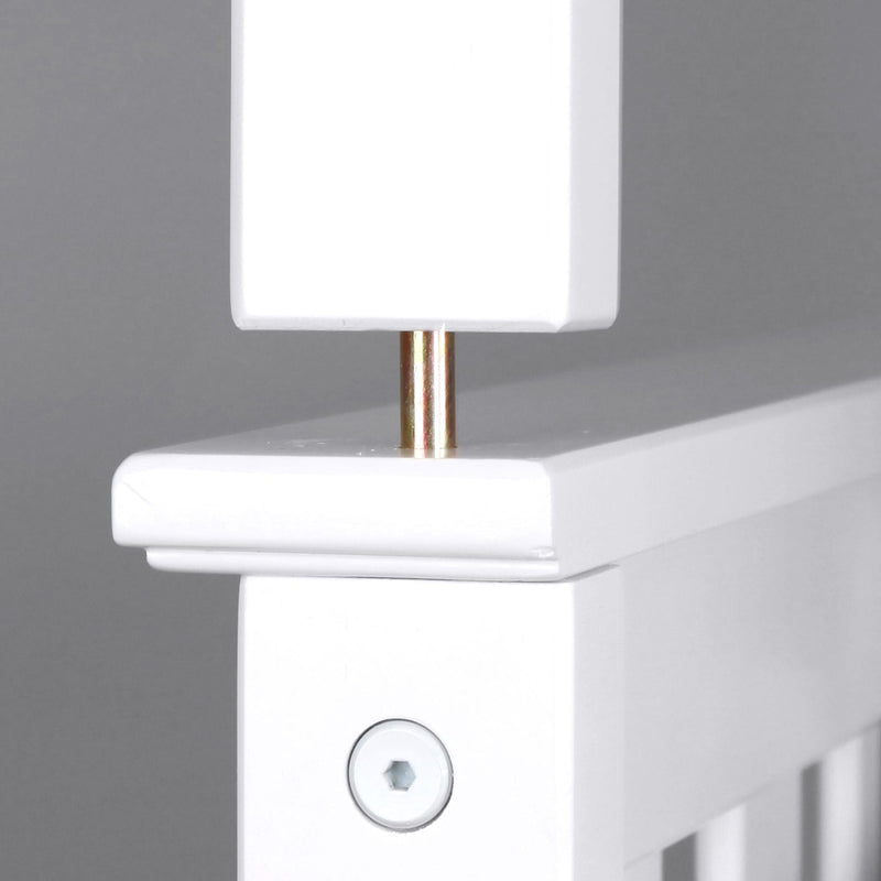 Close-up of white painted wooden furniture post showing brass dowel and hex screw detail, modern bed frame furniture assembly hardware