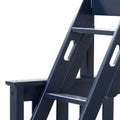 Close-up of navy blue wooden Adirondack chair showing slatted seat, armrest and angled back detail — outdoor patio furniture image
