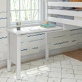 White bunk bed with built-in desk and colorful decor in a bright room.