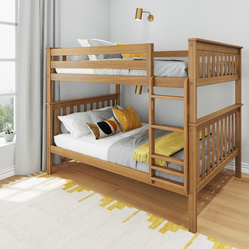 Natural wood bunk bed with ladder, gray bedding and mustard yellow accent pillows in a modern kids' bedroom with gray curtains and brass wall sconce