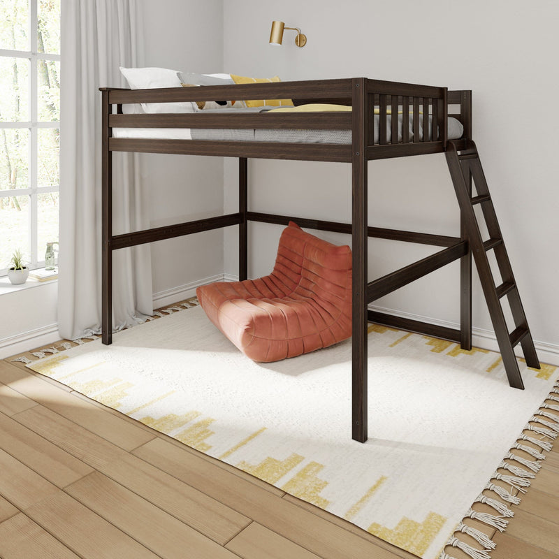 Dark wood loft bed with ladder and guardrail over cozy orange lounge chair, white and yellow patterned rug, window with curtains and brass wall sconce, space-saving bedroom setup