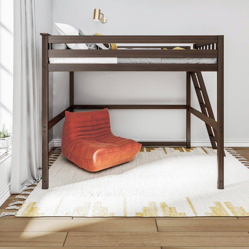 Modern walnut wooden loft bed with ladder, white bedding and yellow accent pillow above an orange lounge chair on a white patterned rug in a bright minimalist bedroom