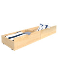 Pair of natural pine wooden under-bed storage drawers with casters holding bedding and pillows — roll-out trundle storage organizer for kids' bedroom