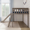 Neutral nursery with wooden kids' loft bed and slide, navy bedding, white shiplap wall and large window with sheer curtains