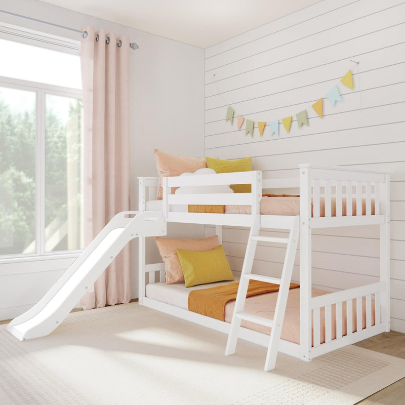 White wooden kids bunk bed with slide in bright pastel children's bedroom with shiplap wall, pink curtains and bunting