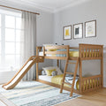 Wooden kids bunk bed with slide and yellow bedding in a bright modern children's bedroom with cat wall art, sheer curtains, and natural light