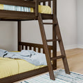 Close-up of dark walnut wooden bunk bed ladder with yellow mattress and light blue blanket in modern kids bedroom on hardwood floor
