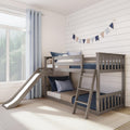 Gray wooden bunk bed with slide in a children's room, navy and beige pennant garland on white shiplap wall, light blue curtains and pillows